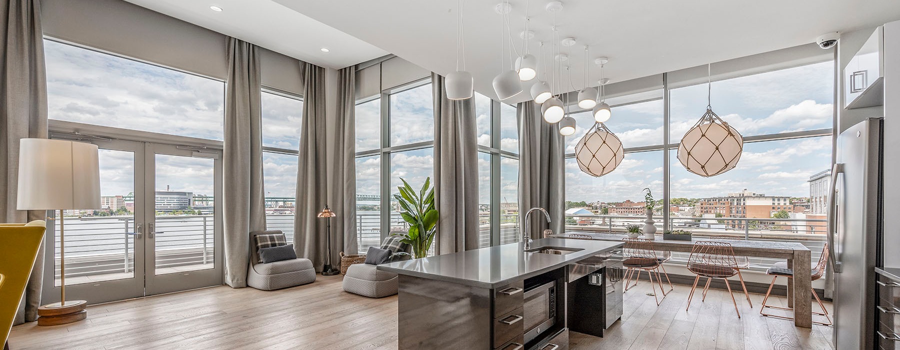 floor-to-ceiling windows brighten spacious, open concept clubhouse