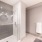Well lit bathroom with tile backsplash and a glass enclosed shower