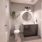 Luxurious bathroom brightened by lighting fixtures over sink and bathtub/shower combo