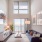 Boston East apartment with high ceilings and large, bright windows in living room
