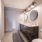 Modern with brightly lit vanity and sink area in a Boston East apartment home