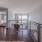 Second floor landing with study area and balcony overlooking the first floor of an open-loft style home